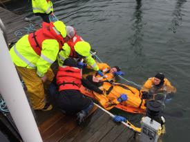 Victim is lifted to dock